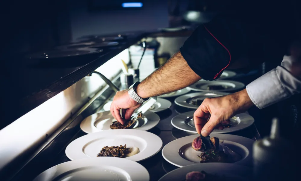 men cooking hands and plates