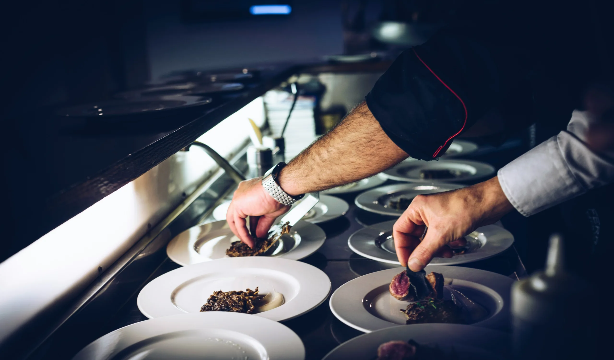 men cooking hands and plates